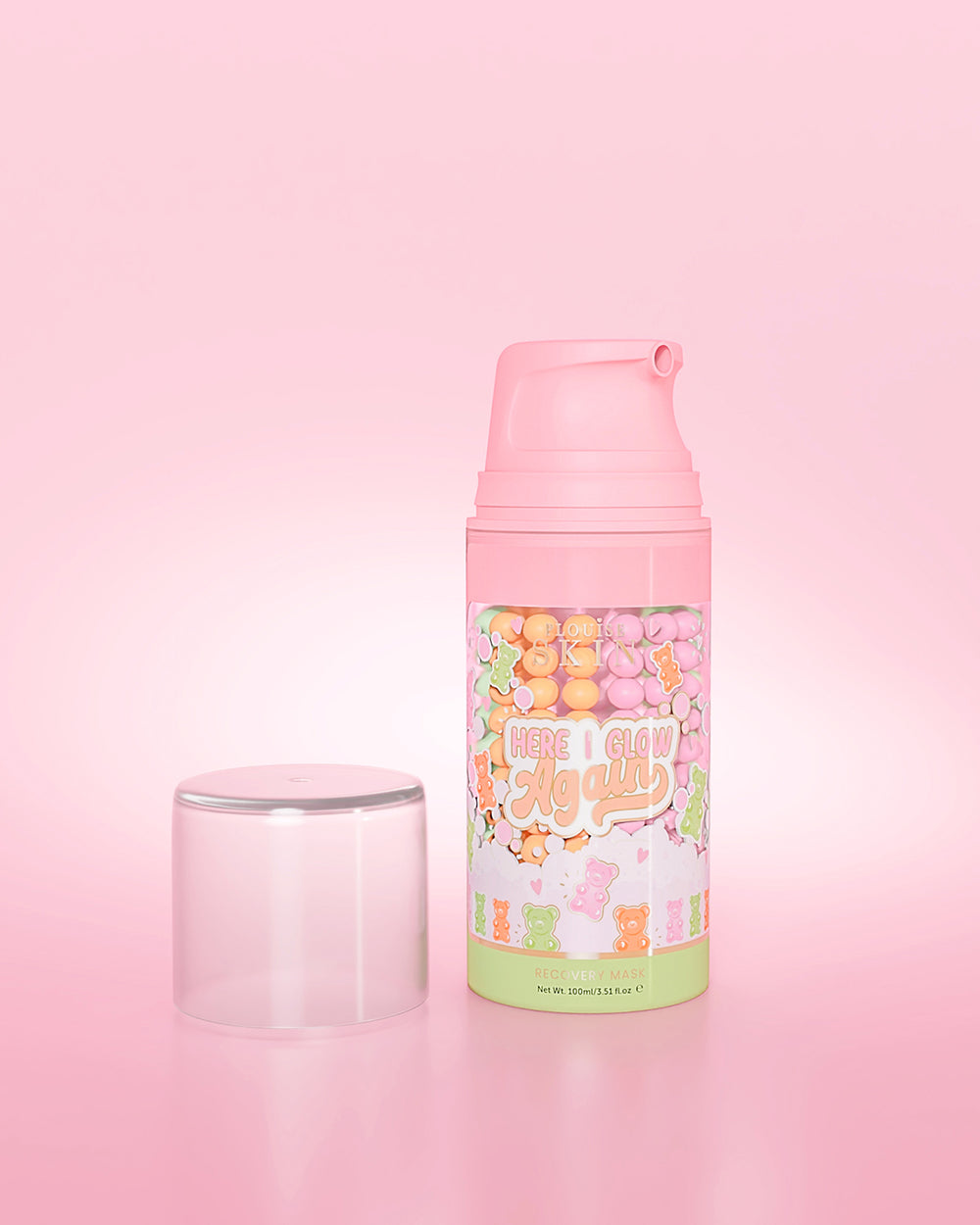 Bottiglia viola di P. Louise Here I Glow Again Candy Bears Recovery Mask su sfondo rosa