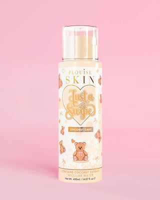 Bottle of P.Louise coconut cake just a swipe micellar water ion a pink background