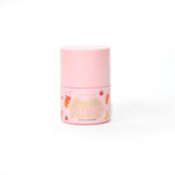 Pink bottle of P.Louise Pass The Plump Lip Treatment on a white background