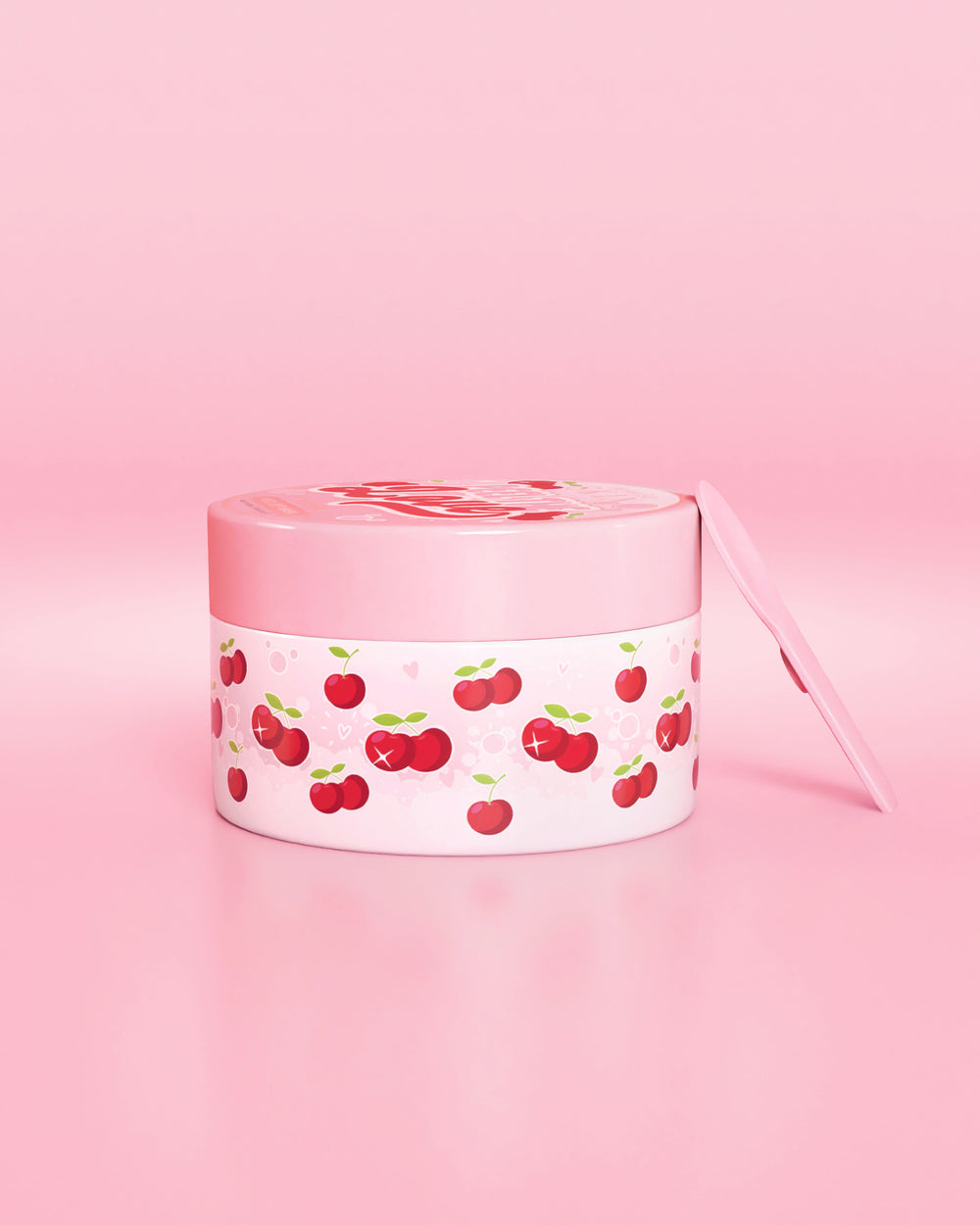 Contenitore rosa con disegno di ciliegie su sfondo rosa