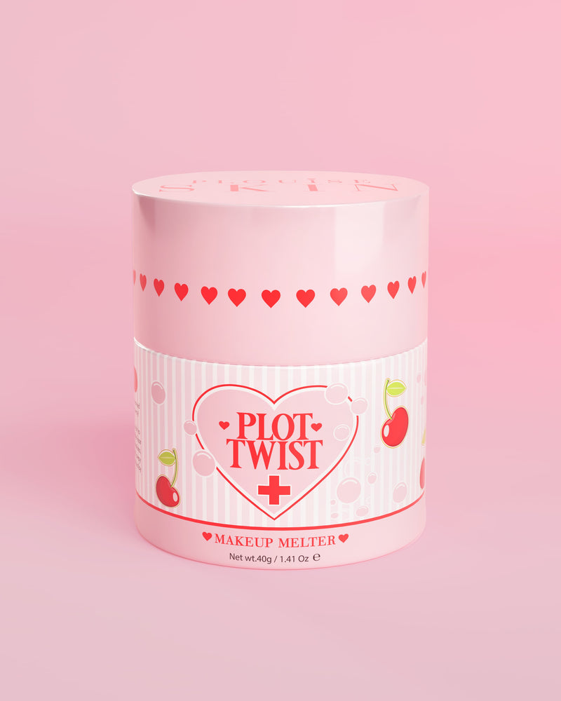 Un contenitore rosa di P.Louise Plot Twist Makeup Melting Cleansing Balm con disegni di cuori e ciliegie sull'etichetta su uno sfondo rosa