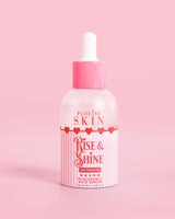 Flacone rosa rosso e bianco di siero all'acido ialuronico P.Louise Rise & Shine all'anguria