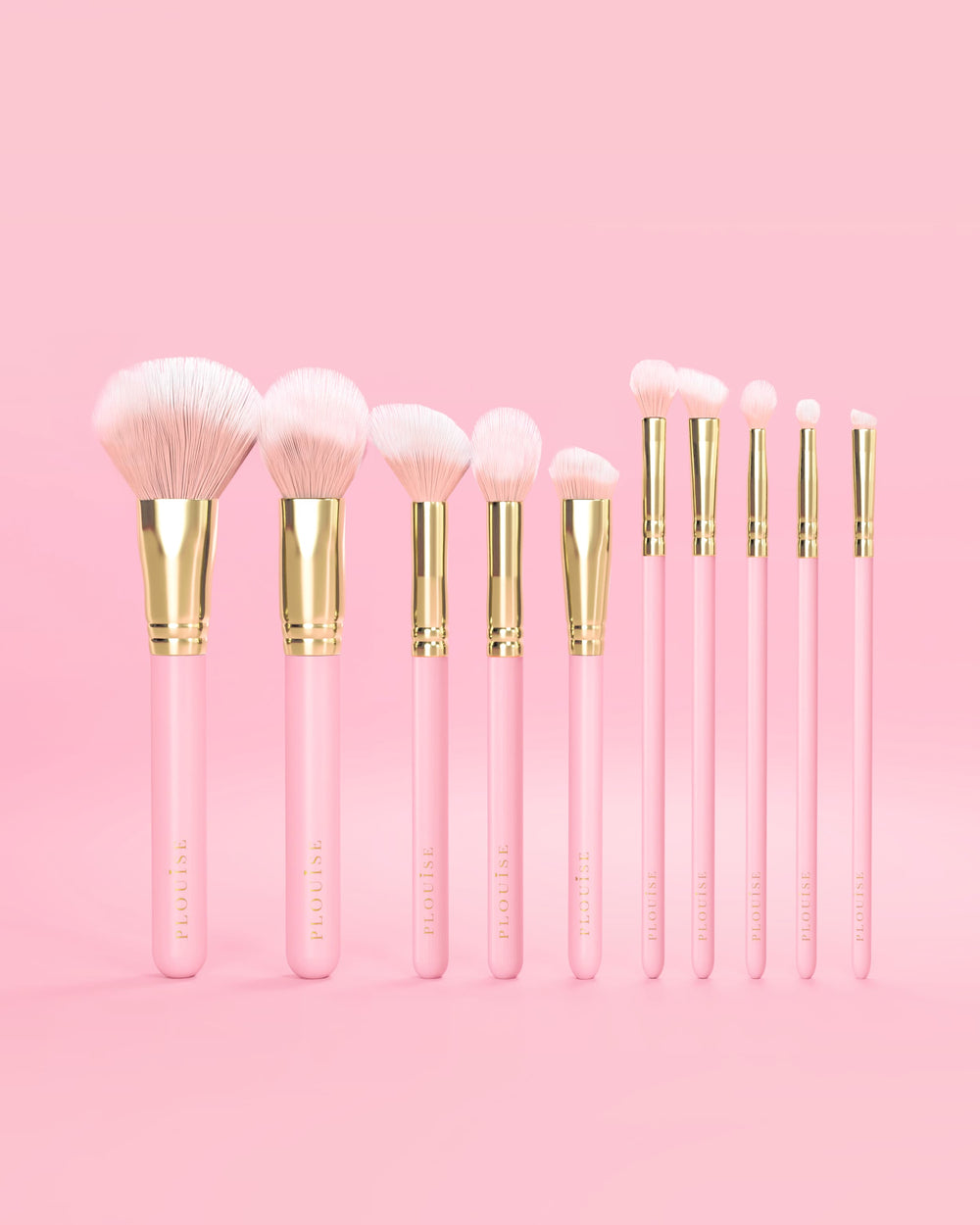 Set di 10 pennelli per trucco P.Louise rosa con manici rosa e dettagli dorati su sfondo rosa