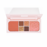 Un'immagine della palette P.Louise Fluffy Fantasy Mini Eyes & Face con matt cremosi e riflessi burrosi in una gamma di tonalità pesca, marroni e neutre