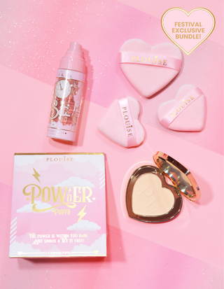 An image of the P.Louise under eye brightening powder that's open, pink heart-shaped powder puffs and a bottle of the P.Louise setting spray on a pink background